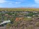 Aerial view of the community showcasing the desert landscape and mountain views at 6349 E Hummingbird Ln, Paradise Valley, AZ 85253