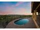 Enjoy stunning sunset views from the lovely pool and brick patio at 6349 E Hummingbird Ln, Paradise Valley, AZ 85253