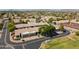 Scenic aerial view of a well-maintained neighborhood with lush greenery and tile-roofed homes at 64 N 63Rd N St # 33, Mesa, AZ 85205