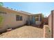 Enclosed backyard offering a private outdoor space adjacent to an enclosed sunroom at 64 N 63Rd N St # 33, Mesa, AZ 85205