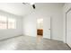 Bright bedroom with wood-look flooring, closet, and ensuite bathroom access at 64 N 63Rd N St # 33, Mesa, AZ 85205