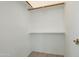 A well-organized walk-in closet features a sturdy wood rod and shelf for optimal storage at 64 N 63Rd N St # 33, Mesa, AZ 85205