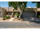 Charming single-story home with well-maintained landscaping and a spacious two-car garage at 64 N 63Rd N St # 33, Mesa, AZ 85205