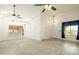 Bright and airy living room featuring vaulted ceilings, skylight, and wood-look tile floors at 64 N 63Rd N St # 33, Mesa, AZ 85205