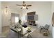 Bright and airy living room features a modern entertainment center, a sleek sofa, and a cozy chair at 64 N 63Rd N St # 33, Mesa, AZ 85205