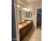 Spacious bathroom with double vanity and tiled floors at 7052 E Kessler Ave, Mesa, AZ 85209