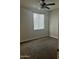 Neutral bedroom with carpet flooring and a ceiling fan at 7052 E Kessler Ave, Mesa, AZ 85209
