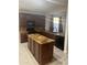 Well-lit kitchen with stainless steel appliances, granite countertops, and a center island at 7052 E Kessler Ave, Mesa, AZ 85209