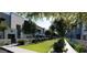 Inviting street view with modern townhomes, manicured lawns, and mature trees for a serene setting at 733 E Commonwealth Ave # 36, Chandler, AZ 85225