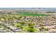 A stunning aerial view of a vibrant community showcasing green spaces and a beautiful skyline at 7413 S 32Nd Dr, Phoenix, AZ 85041