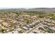 An aerial shot showcases a suburban neighborhood with well-manicured landscaping and tile roofs at 7413 S 32Nd Dr, Phoenix, AZ 85041