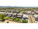 An aerial view showcasing a well-kept home with a backyard play area within a vibrant neighborhood at 7413 S 32Nd Dr, Phoenix, AZ 85041