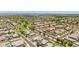 An aerial view features a well-planned community with green spaces, tree-lined streets, and diverse home styles at 7413 S 32Nd Dr, Phoenix, AZ 85041