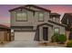 Charming two-story home featuring a two-car garage and neatly manicured landscaping at 7413 S 32Nd Dr, Phoenix, AZ 85041