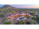 Charming desert home with a pool, spa, and lush backyard oasis nestled amidst the stunning mountain views at 8024 E Lone Mountain Rd, Scottsdale, AZ 85266