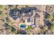 Beautiful desert home featuring a private pool, jacuzzi, and an outdoor artificial lawn at 8024 E Lone Mountain Rd, Scottsdale, AZ 85266