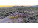 Spacious desert home with a porte cochere and lush, mature landscaping set against stunning mountain views at 8024 E Lone Mountain Rd, Scottsdale, AZ 85266