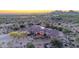 Majestic estate with a porte cochere, lush landscaping, and mountain views in a serene desert setting at 8024 E Lone Mountain Rd, Scottsdale, AZ 85266