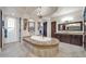Bright bathroom with a luxurious soaking tub, chandelier, and dual vanities at 8024 E Lone Mountain Rd, Scottsdale, AZ 85266