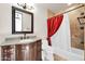 Bathroom featuring a vanity with a dark wooden cabinet and granite countertop and shower at 8024 E Lone Mountain Rd, Scottsdale, AZ 85266