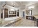 Bright bathroom with a luxurious soaking tub, chandelier, and dual vanities at 8024 E Lone Mountain Rd, Scottsdale, AZ 85266