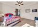 Bedroom with a wooden bed and ensuite bathroom view at 8024 E Lone Mountain Rd, Scottsdale, AZ 85266