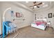 Bedroom with a hanging chair, ceiling fan, and a nicely made bed at 8024 E Lone Mountain Rd, Scottsdale, AZ 85266