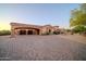 Desert home featuring a circular driveway and three-car garage at 8024 E Lone Mountain Rd, Scottsdale, AZ 85266