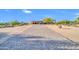 Elegant home featuring a long, paved driveway, beautiful landscaping, and a grand entrance at 8024 E Lone Mountain Rd, Scottsdale, AZ 85266