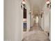 Bright hallway boasting sconce lighting, neutral walls, and a built-in beverage center at 8024 E Lone Mountain Rd, Scottsdale, AZ 85266