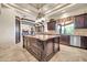 Spacious kitchen with a large island, stainless steel appliances, and granite countertops at 8024 E Lone Mountain Rd, Scottsdale, AZ 85266
