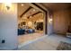 Inviting living room featuring elegant wood beams, recessed lighting, and smooth tile flooring at 8024 E Lone Mountain Rd, Scottsdale, AZ 85266