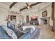 Bright living room with beamed ceilings, an open layout and access to the wet bar area at 8024 E Lone Mountain Rd, Scottsdale, AZ 85266
