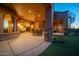Spacious covered patio with seamless indoor-outdoor living, featuring a dining area and a spiral staircase at 8024 E Lone Mountain Rd, Scottsdale, AZ 85266