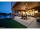 Inviting outdoor patio with a dining area, ceiling fan, and seamless transition to indoor living space at 8024 E Lone Mountain Rd, Scottsdale, AZ 85266