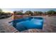 Beautiful pool with a tiled waterfall feature and clean blue water, perfect for relaxation and entertainment at 8024 E Lone Mountain Rd, Scottsdale, AZ 85266
