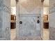 Large walk-in shower with designer tile, bronze fixtures, and dual shower heads at 8024 E Lone Mountain Rd, Scottsdale, AZ 85266