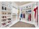 Walk-in closet with custom shelving and ample storage space for shoes and clothes at 8024 E Lone Mountain Rd, Scottsdale, AZ 85266
