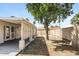 Backyard with a mix of patio space and natural areas beneath a tree at 9622 N 35Th Ln, Phoenix, AZ 85051