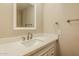 A bright, clean bathroom featuring white cabinetry and a modern faucet at 9622 N 35Th Ln, Phoenix, AZ 85051