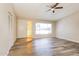 Bright living room features wood-look floors and a ceiling fan at 9622 N 35Th Ln, Phoenix, AZ 85051