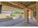 Inviting covered patio with desert landscaping, a fountain, and ample space for outdoor relaxation at 9797 N 100Th Pl, Scottsdale, AZ 85258