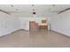 Spacious garage with epoxy floors, storage cabinets, a refrigerator and ample room for vehicles or projects at 9797 N 100Th Pl, Scottsdale, AZ 85258