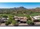 Gorgeous aerial view of estate home near golf course with mountain views at 10641 E Blue Sky Dr, Scottsdale, AZ 85262
