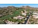 View of a desert landscaped estate home located on golf course with Mountain View at 10641 E Blue Sky Dr, Scottsdale, AZ 85262