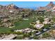 Scenic aerial view of homes in a golf community, with desert landscaping and mountain views at 10641 E Blue Sky Dr, Scottsdale, AZ 85262