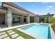 A luxury backyard features a large patio, desert landscaping, a pool, and unobstructed views at 10641 E Blue Sky Dr, Scottsdale, AZ 85262