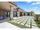 Backyard boasts a large patio, walkways, a pool, desert landscaping, and unobstructed views at 10641 E Blue Sky Dr, Scottsdale, AZ 85262