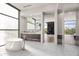 Elegant bathroom features a soaking tub, marble countertops, and seamless flow to the bedroom at 10641 E Blue Sky Dr, Scottsdale, AZ 85262