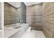 Contemporary bathroom features a marble countertop, modern fixtures, and unique wooden paneling for a luxurious feel at 10641 E Blue Sky Dr, Scottsdale, AZ 85262